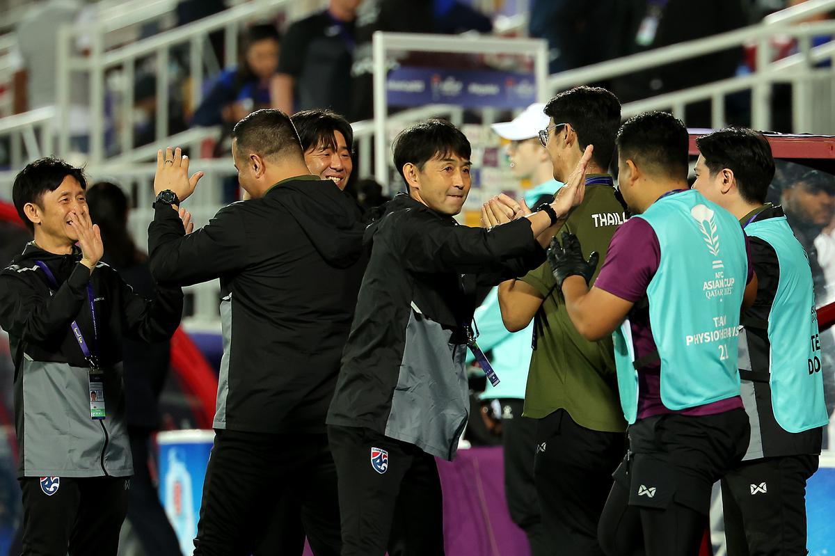 Job done and dusted: Masatada Ishii, Head Coach of Thailand celebrates after his team secured a knockout spot in the AFC Asian Cup 2023 in Doha, Qatar.