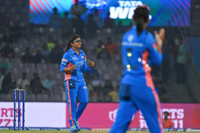 Saika Ishaque of Mumbai Indians celebrates after taking a wicket.