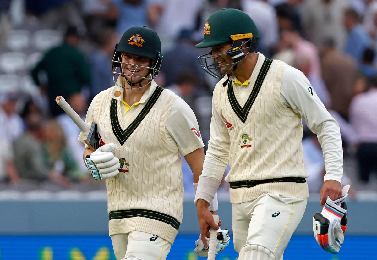 Australia’s Steven Smith (L) and Australia’s Alex Carey leave the pitch at the end of play on day one of the second Ashes cricket Test match between England and Australia at Lord’s cricket ground in London.