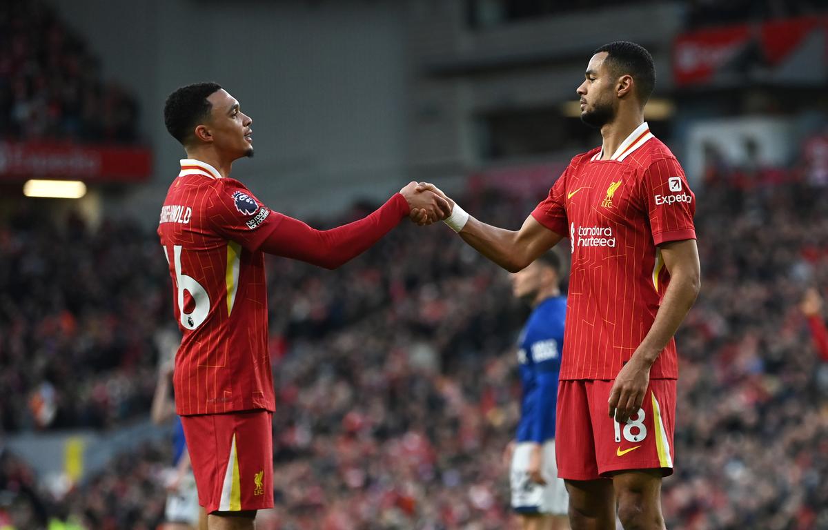 Cody Gakpo celebrates scoring his team’s fourth goal with teammate Trent Alexander-Arnold of Liverpool during the Premier League match between Liverpool FC and Ipswich Town FC at Anfield on January 25, 2025 in Liverpool, England.