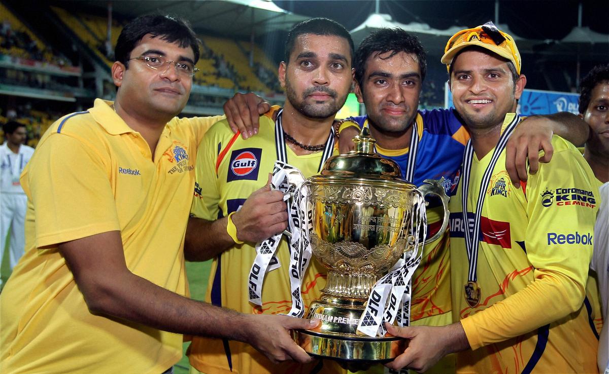 Ashwin (second from right) poses with the IPL trophy, after winning the final against Royal Challengers Bangalore in 2011.