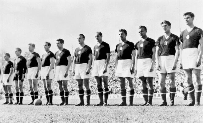 The Hungarian team is lined up during the national anthem before its World Cup first round match against West Germany  20 June 1954 in Basel. (From L : Ferenc Puskas, Gyula Grosics, Gyula Lorant, Nandor Hidegkuti, Jozsef Boszik, Mihaly Lantos, Jeno Buzansky, Jozsef Zakarias, Jozsef Toth II, Zoltan Czibor, Sandor Kocsis).