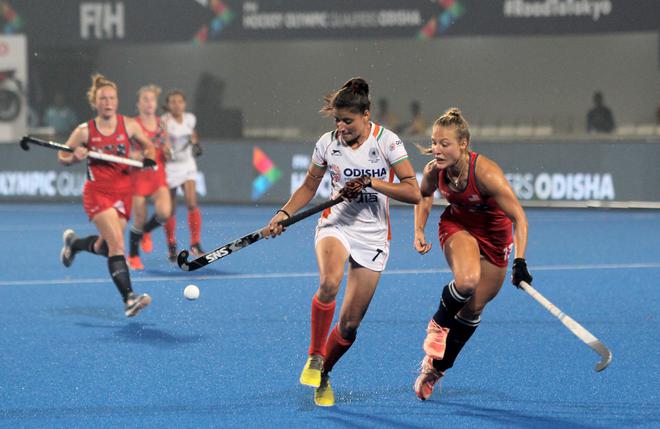 Indian player Sharmila Devi (No.7) in action against USA in the first leg of the women’s hockey Olympic qualifers match.