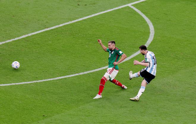 Messi fires in a shot which opened the scoring for Argentina.