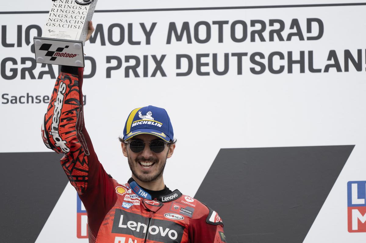 Francesco Bagnaia of Italy and Ducati Lenovo Team celebrates the victory on the podium at the end of the MotoGP race during the MotoGP Of Germany - Race at Sachsenring Circuit.