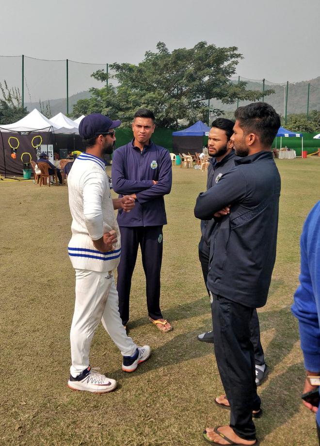 Mumbai skipper Ajinkya Rahane having a chat with the Assam players during the Ranji Trophy match. 