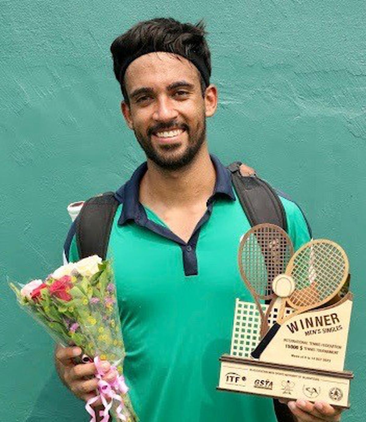 Florent Bax of France, with the title in the ITF men’s tennis tournament in Ahmedabad on Saturday.