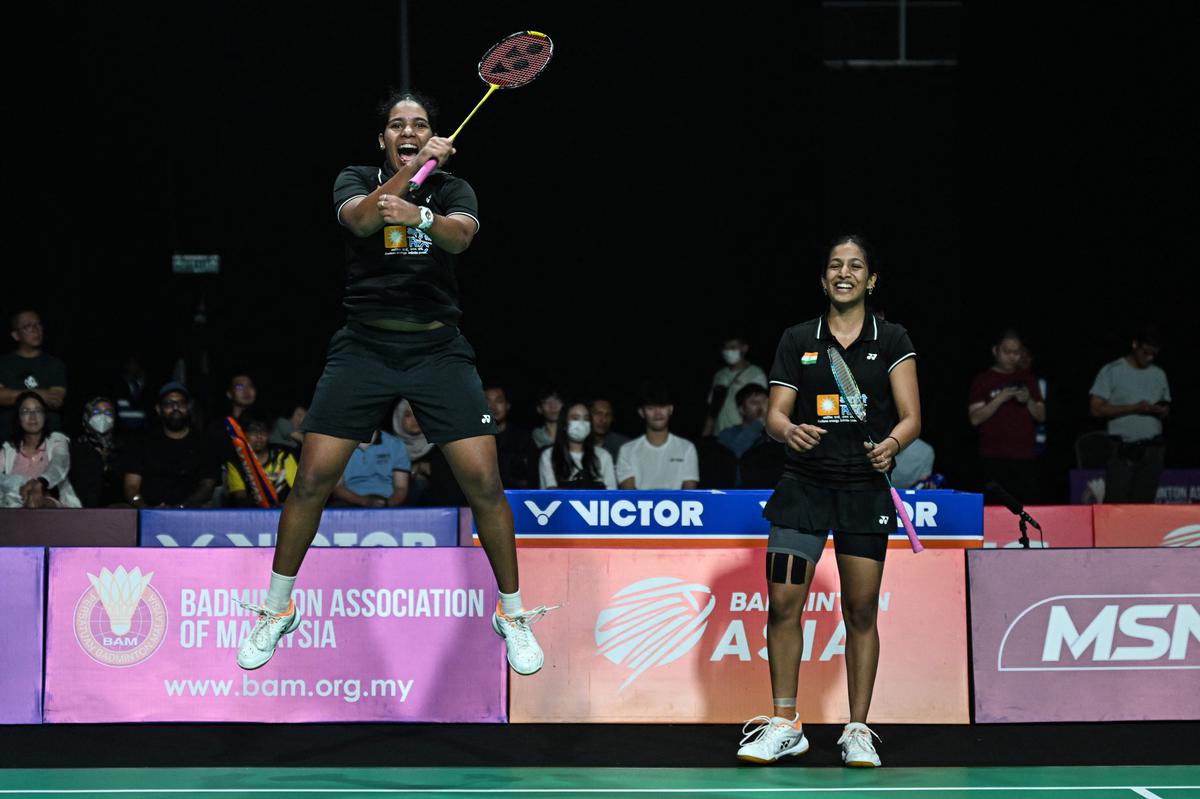 Top of the world: Treesa Jolly (L) and Gayatri Gopichand celebrate after winning against Thailand’s Rawinda Prajongjai and Jongkolphan Kititharakul in their doubles finals match at the Badminton Asia Team Championships (BATC). 