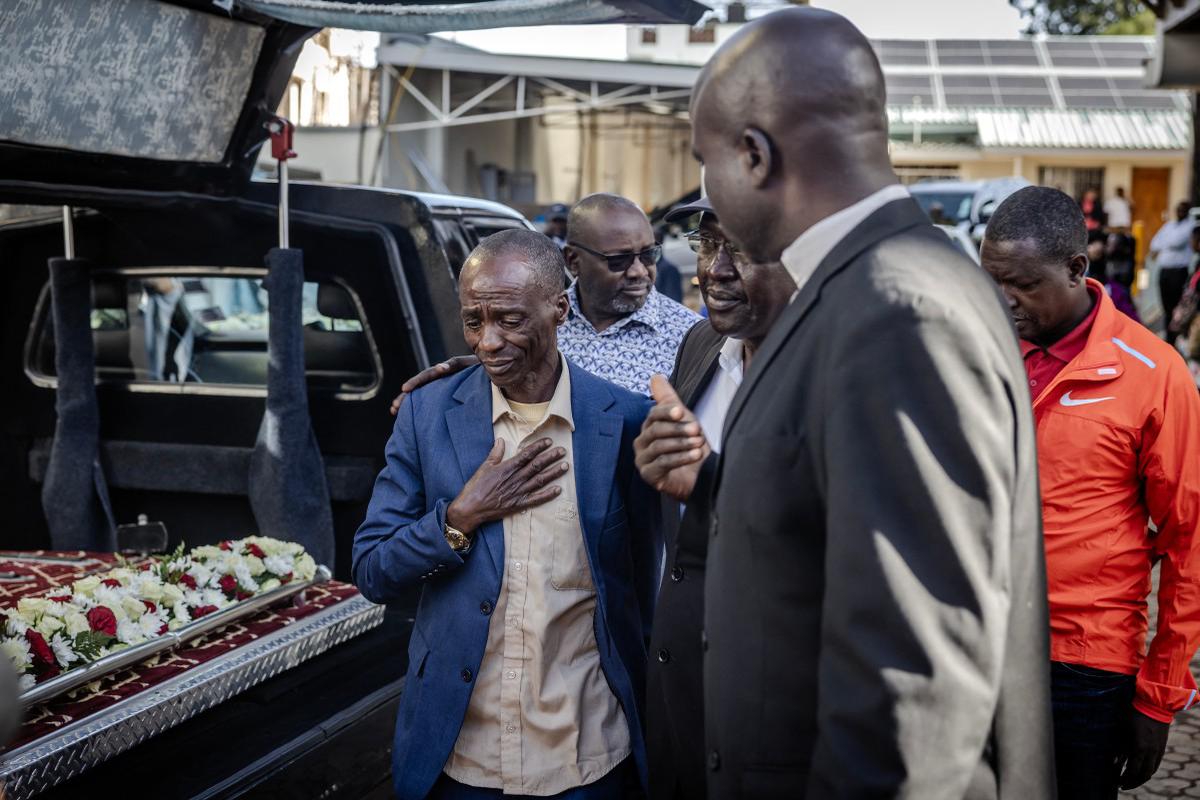 Kelvin Kiptum’s father Samson Cheruiyot (C) reacts while arriving to the mortuary ahead of the beginning of his son’s funeral proceedings in Eldoret.