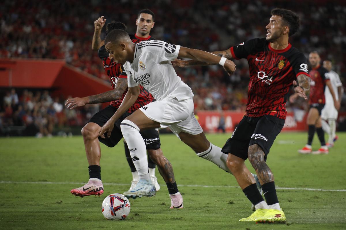 Real Madrid’s Kylian Mbappe, centre, bursts through the Mallorca defence during a Spanish La Liga match between Mallorca and Real Madrid at the Son Moix Stadium in Palma de Mallorca.