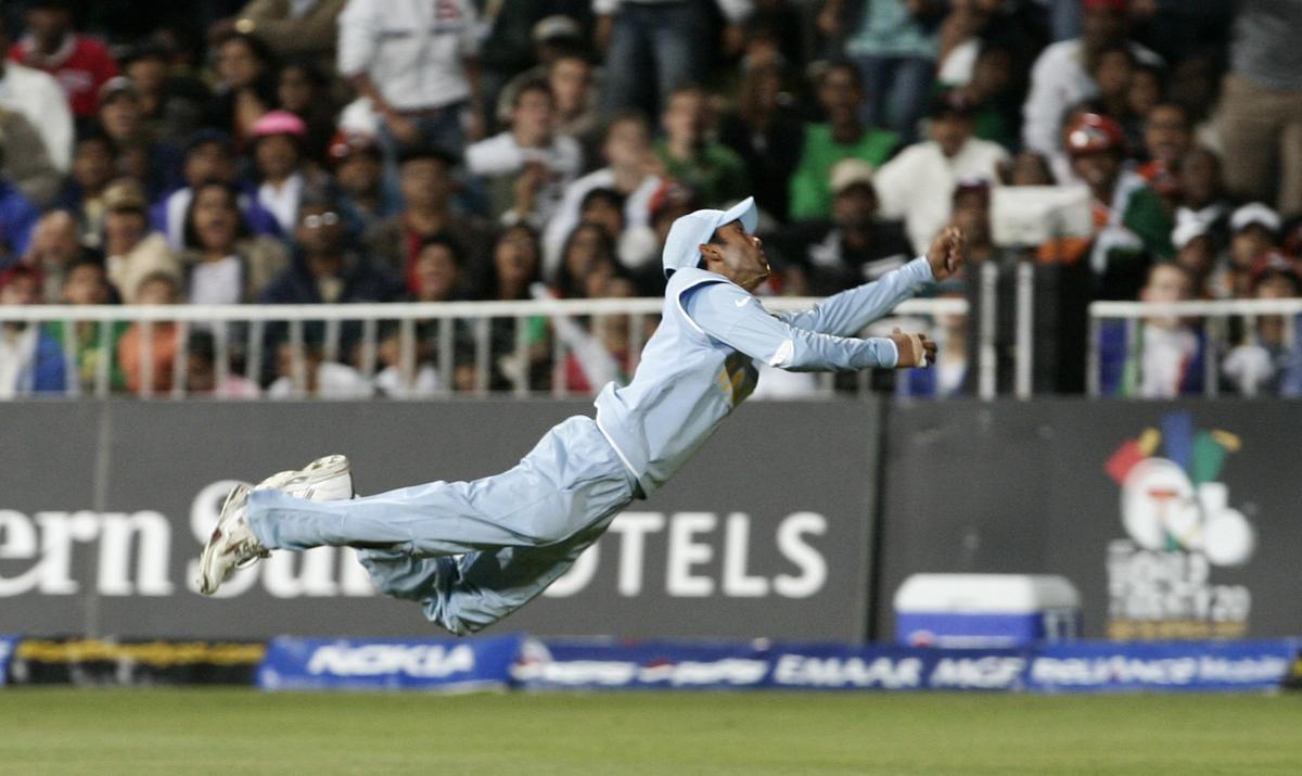 Dinesh Karthik dives to stop the ball against Pakistan during their T20 World Cup.