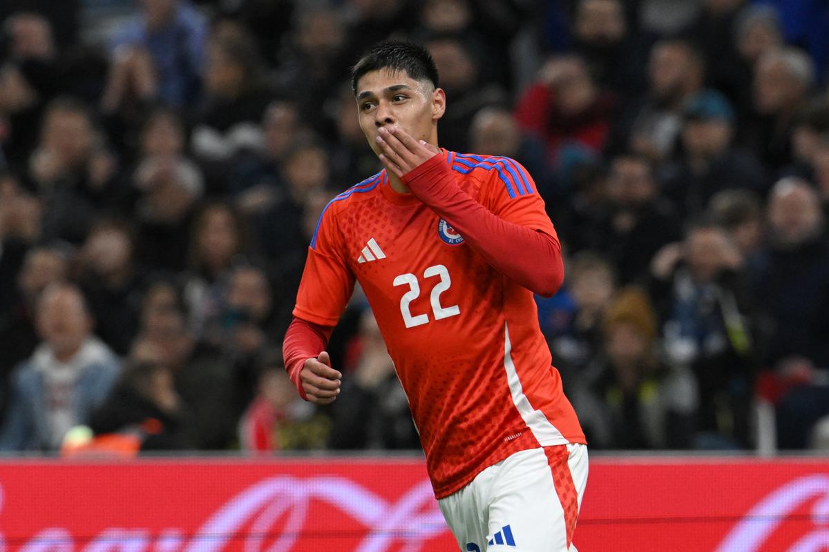 Chile’s forward #22 Dario Osorio celebrates scoring his team’s second goal during the friendly football match between France and Chile at the Stade Velodrome in Marseille, southern France, on March 26, 2024. 