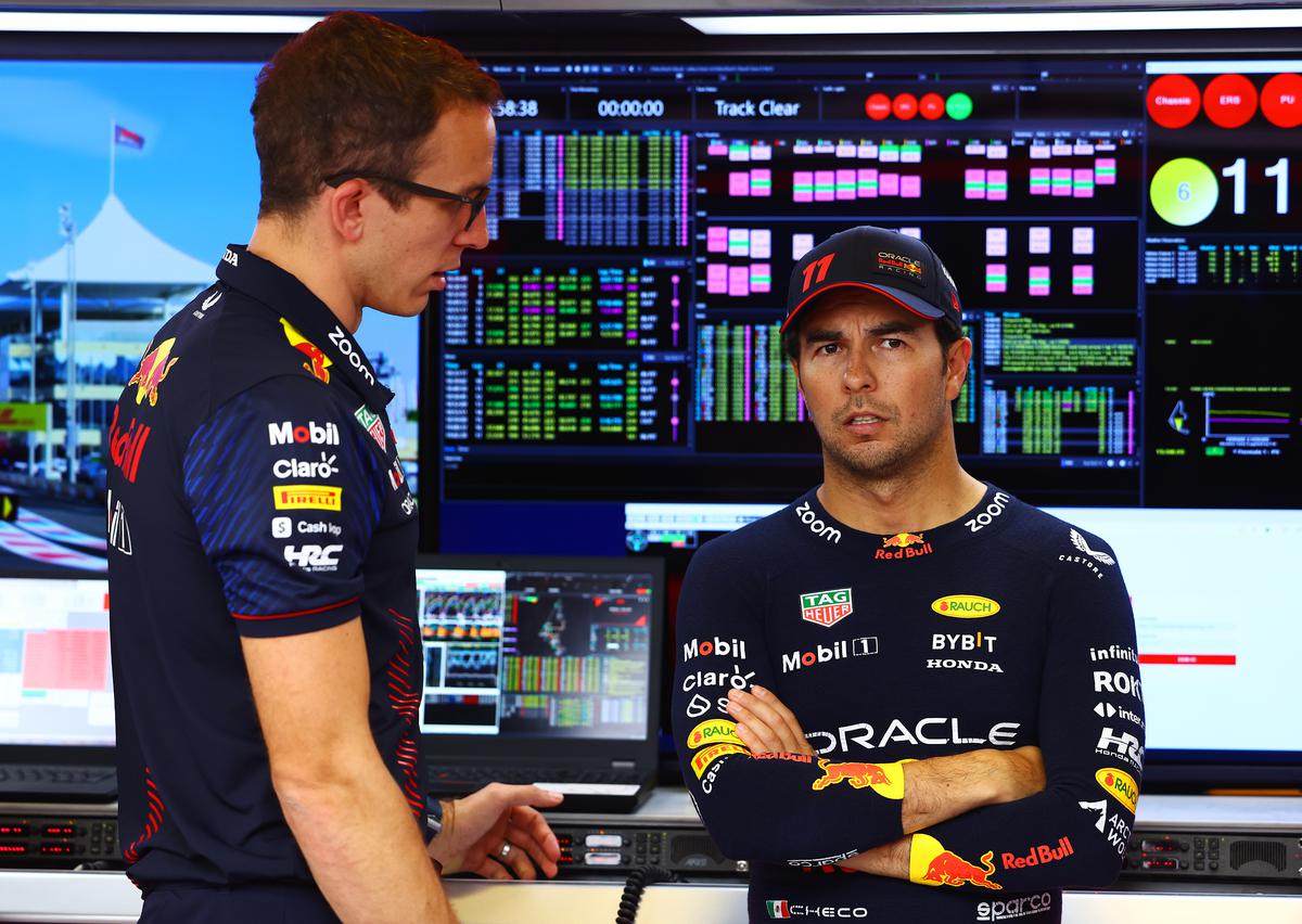 FILE PHOTO: Sergio Perez of Mexico and Oracle Red Bull Racing talks with race engineer Hugh Bird in the garage prior to the F1 Grand Prix of Abu Dhabi at Yas Marina Circuit.