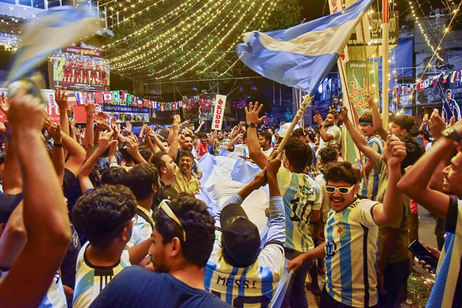 Argentina fans celebrate the team’s victory in the semifinal against Croatia in Kochi, Kerala, on December 14, 2022. 
