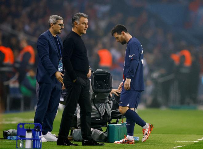 Paris St Germain’s Lionel Messi walks past coach Christophe Galtier after being  substituted in a Ligue 1 games against Marseille. 