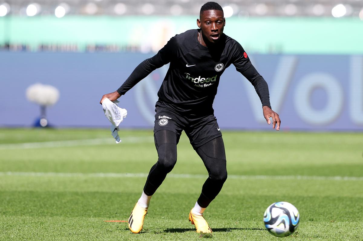 Randal Kolo Muani of Eintracht Frankfurt controls the ball during a training session one day ahead of the DFB Cup Final between RB Leipzig and Eintracht Frankfurt at Olympiastadion.