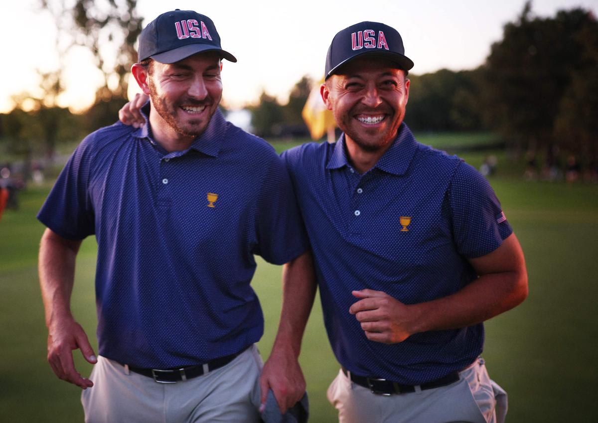 Patrick Cantlay and Xander Schauffele of the U.S. Team celebrate during Saturday Afternoon Foursomes on day three of the 2024 Presidents Cup.