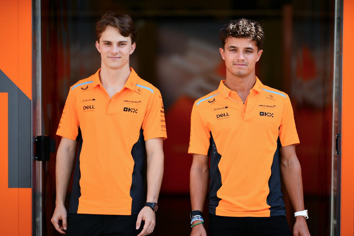 Lando Norris of Great Britain and McLaren and Oscar Piastri of Australia and McLaren pose for a photo in the Paddock during previews ahead of the F1 Grand Prix of Azerbaijan at Baku City Circuit.