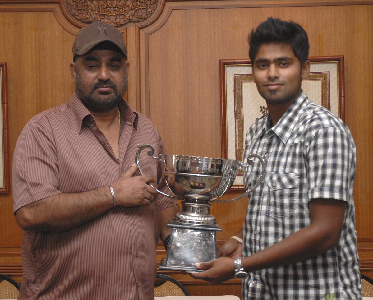 Balwinder Singh Sandhu presenting the Sportstar trophy to Suryakumar Yadav, captain of Vijay Manjrekar XI and Player of the Tournament. 