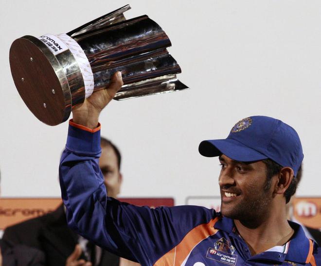 Mahendra Singh Dhoni holds this trophy following India's victory over Sri Lanka in the 2010 Asian Cup final at Dambulla on June 24, 2010.