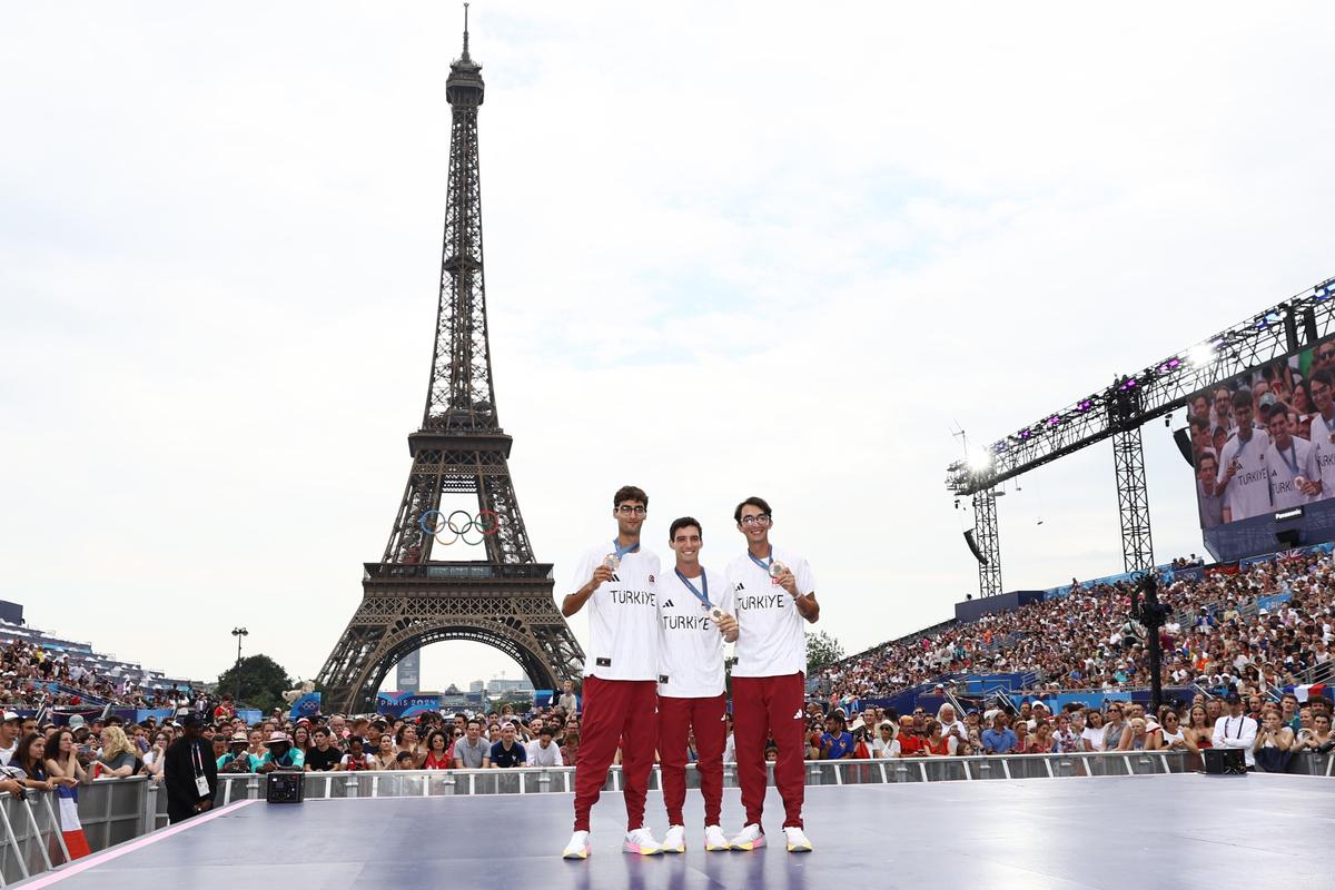 Rising force: Turkiye’s archery trio (L-R) Abdullah Yildirmis, Berkim Tumer and Mete Gazoz celebrate their team bronze at Paris 2024, their smiles reflecting a nation’s quiet ascent in the sport. 