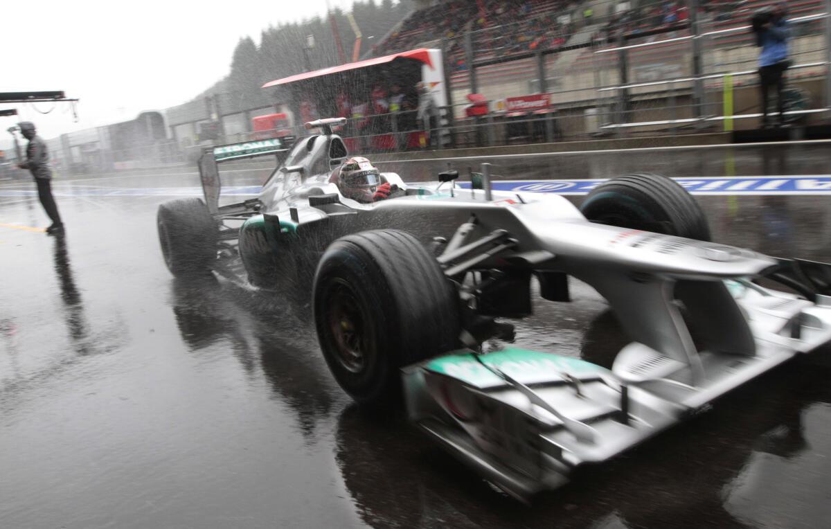 Mick Schumacher, son of seven-time F1 world champion Michael Schumacher,  sits in his car prior to an exhibition lap ahead of the Belgian Formula One  Grand Prix in Spa-Francorchamps, Belgium, Sunday, Aug.