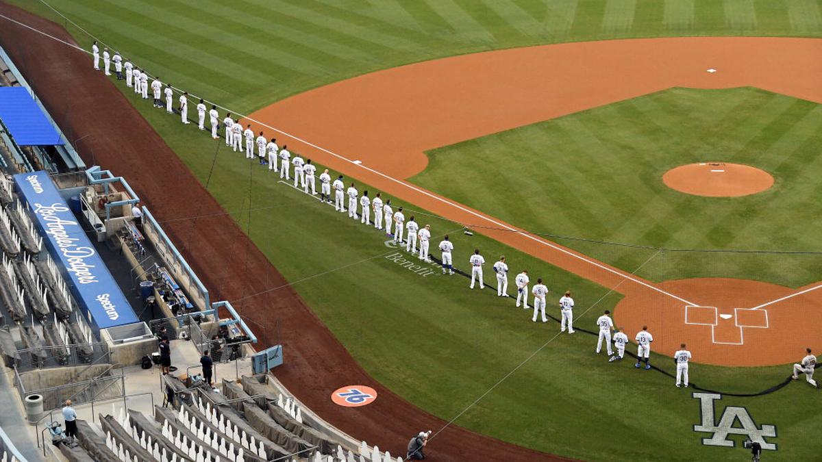 Major League Baseball players protest racial inequality at season opener