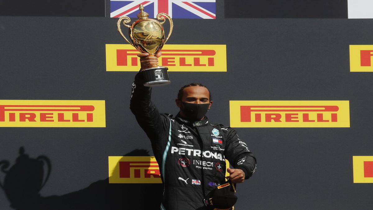 Lewis Hamilton limps to record British GP win after late puncture