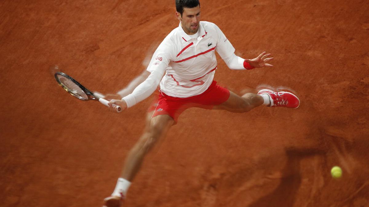 Djokovic survives injury scare to beat Busta in French Open quarters