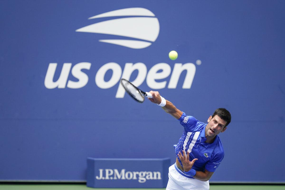 US Open Djokovic overcomes slow start to extend win streak