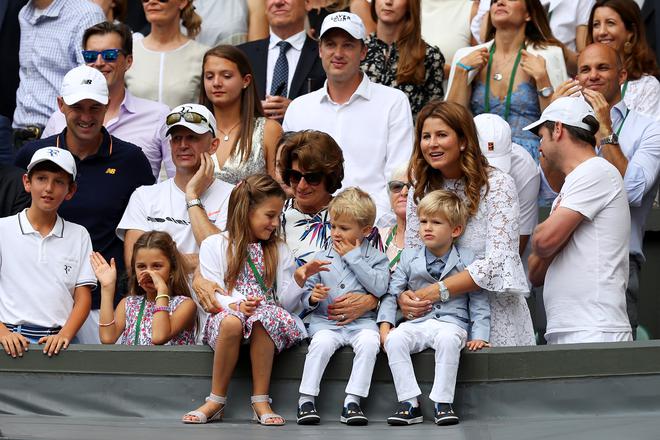 Symbol of strength: Federer’s wife Mirka and his children watch him in action at Wimbledon.