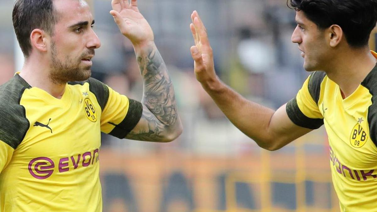 Borussia Dortmund 2 Wolfsburg 0, as Bayern draw